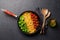 A vibrant representation of the Italian flag made with pasta, basil, and tomatoes