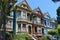 A vibrant row of houses on a hill overlooking the city, Vintage Victorian homes in San Francisco, AI Generated