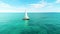 Vibrant Sail Boat Floating On Blue Water - Mesmerizing Ocean Photography