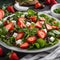 A vibrant salad with mixed greens, strawberries, and goat cheese2