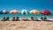 Vibrant seaside boardwalk with colorful beach huts and sun umbrellas for summer promotion