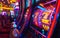 A vibrant slot machine& x27;s spinning reels, illuminated symbols, in a casino with bokeh lights.
