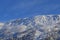 Vibrant snowy mountain peak at sunrise