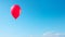 Vibrant Solitary Balloon Floating High in a Clear Blue Sky