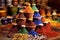 vibrant spice piles in traditional clay pots