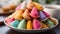 A vibrant stack of colorful macaroons on a wooden plate generated by AI