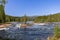 A vibrant summer scene captures the cascading Namsen River in Namsskogan, Trondelag, Norway