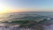 Vibrant sunrise over beach aerial