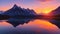 A vibrant sunrise over a tranquil mountain lake.
