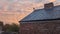 Vibrant Sunrise Reflecting Off Slate Tile Roof