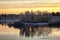 Vibrant sunset in a lake nearby Inari, Finland