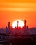 Vibrant sunset over Ontario Place marina in Toronto with silhouettes of the 3 anchors of decommissioned old Great Lakes freighters