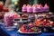 A vibrant table filled with an assortment of luscious fruits, delectable candies candybar