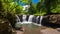 Vibrant Togitogiga falls with swimming hole on Upolu, Samoa.