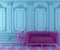 Vibrant turquoise blue interior design background with pink modern transparent couch