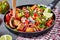 Vibrant,veggie Mexican dish in a cast-iron pan