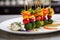 vibrant veggie skewers on a white plate, toothpicks by the side