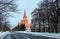 Vibrant view of winter campus of famous university with evergreen tree alley in sunset Moscow