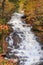 Vibrant waterfall in New England with fall foliage