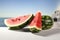 Vibrant watermelon displayed on an unoccupied white workspace