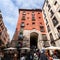 A vibrant weekend morning on the Calle Cava de San Miguel, Madrid, Spain