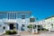 Vibrant white pergola, picket fence front yard curb appeal along scenic 30A country road in Santa Rosa, South Walton Beaches near