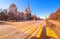 Vibrant wide angle view of long avenue of spring sunny campus of Moscow University with yellow zebra crossroad under blue clean