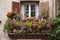 a vibrant window garden overflowing with blooms, complemented by a wooden balcony railing