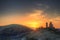 Vibrant Winter landscape sunrise over castle ruins