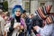 Vibrantly dressed Extinction Rebellion Protester looks directly at the camera at a rally outside Downing Street