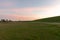 Vibrantly green lawn with Pilsum lighthouse in the distance