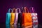 Vibrantly hued shopping bags stand out against a sleek black background