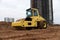 Vibration single-cylinder road roller for leveling soil, gravel, concrete, or asphalt in the construction of roads