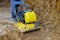 Vibratory plate compactor in construction rammer ground compaction foundation for construction of underground