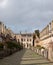 Vicars` Close, in Wells, Somerset UK. Street of medieval terraced houses with iconic chimneys behind Wells Cathedral.