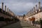 Vicars` Close, in Wells, Somerset UK. Street of medieval terraced houses with iconic chimneys behind Wells Cathedral.