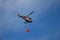 Vicopisano, Pisa, Italy - 25 February 2019: helicopter flies with full water to throw on the fire