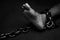 Victim, Slave, Prisoner male tied by big metal chain