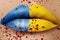 Victims of war in Ukraine. Female lips with yellow blue lipstick and blood splatters