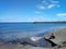 Victoria beach at Terceira Island, Azores, Portugal with the meditative man near the water.