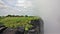 Victoria Falls, Zambia. The plateau, covered with bright green grass, ends with a vertical cliff into the abyss.