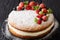 Victoria sandwich cake decorated with fresh summer berries and m