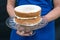 A victoria sponge cake on glass cake stand