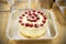 Victoria sponge cake with icing and raspberries