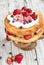 Victoria Sponge Cake with Whipped Cream with Candied Flowers and Berries