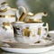 Victorian antique porcelain coffee cup in gold and white