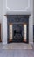 Victorian black cast iron fireplace with coals and marble hearth.