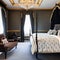 Victorian Gothic Bedroom: A dark and mysterious bedroom with ornate Victorian furniture, velvet drapes, and candle chandeliers4,