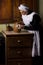 Victorian kitchen maid cleaning