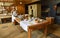 Victorian Kitchen with woman dressed as Victorian Kitchen maid.